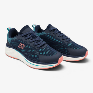 Zapatillas deportivas Nuxual de mujer en azul marino con detalles verdes y coral, suela amortiguada y cierre de cordones