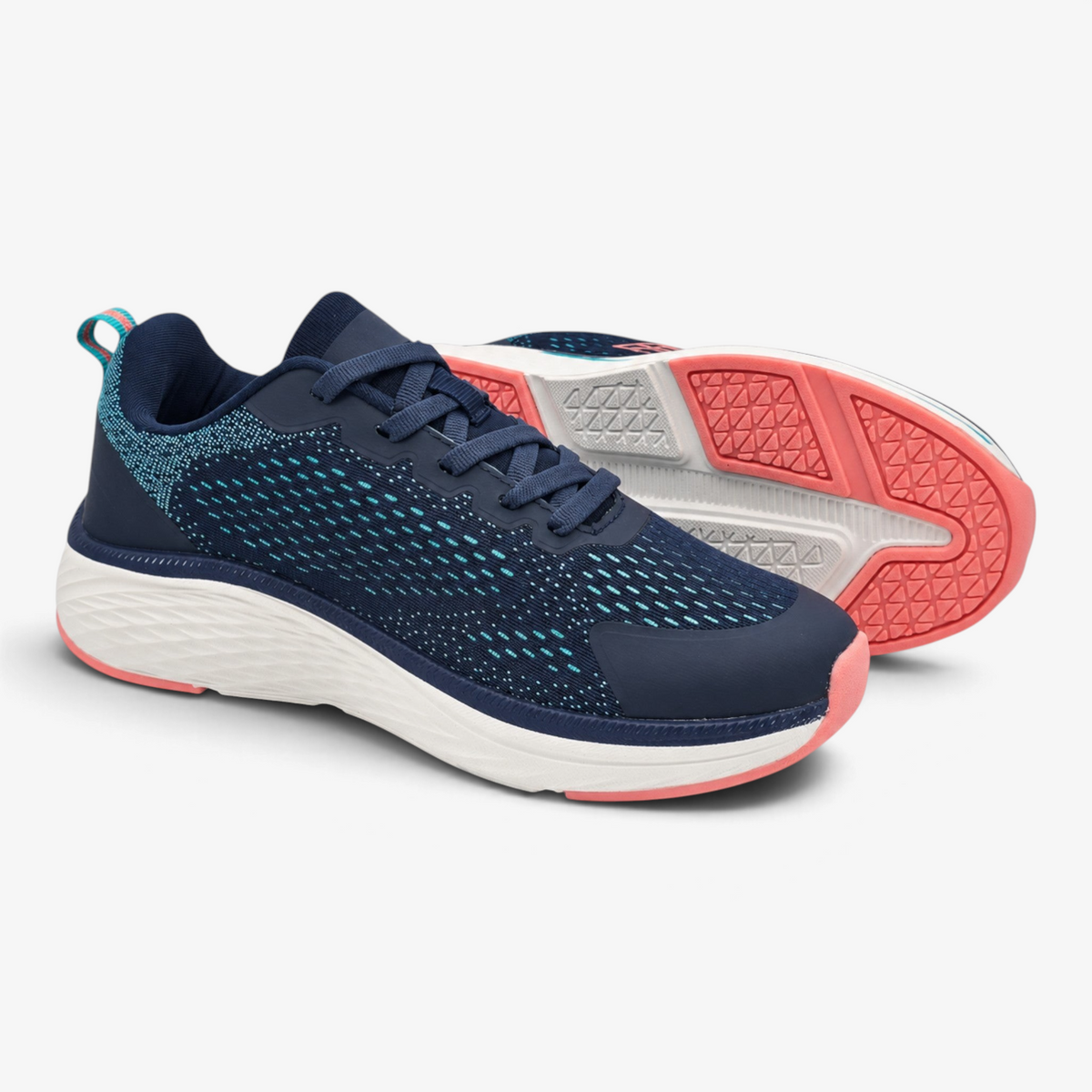 Deportivo confort Nuxual para mujer en azul marino con detalles verdes y coral, suela amortiguada y tejido técnico.