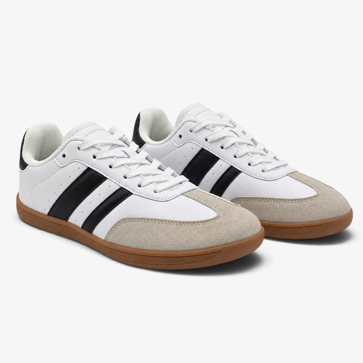 Zapatillas barefoot Nuxual blancas y negras con suela flexible, puntera de ante y diseño vegano de horma ancha.